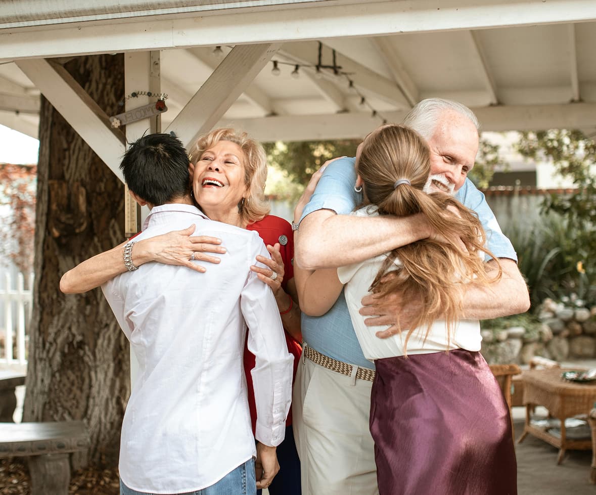 Family smiling with flowers